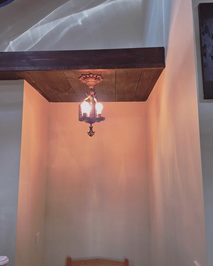 Antique light fixture in a wall alcove in Plattsburgh, NY