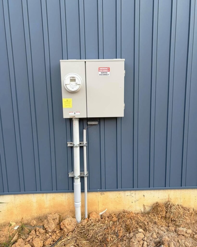 Rooftop service panel and meter at a commercial building in Plattsburgh, NY