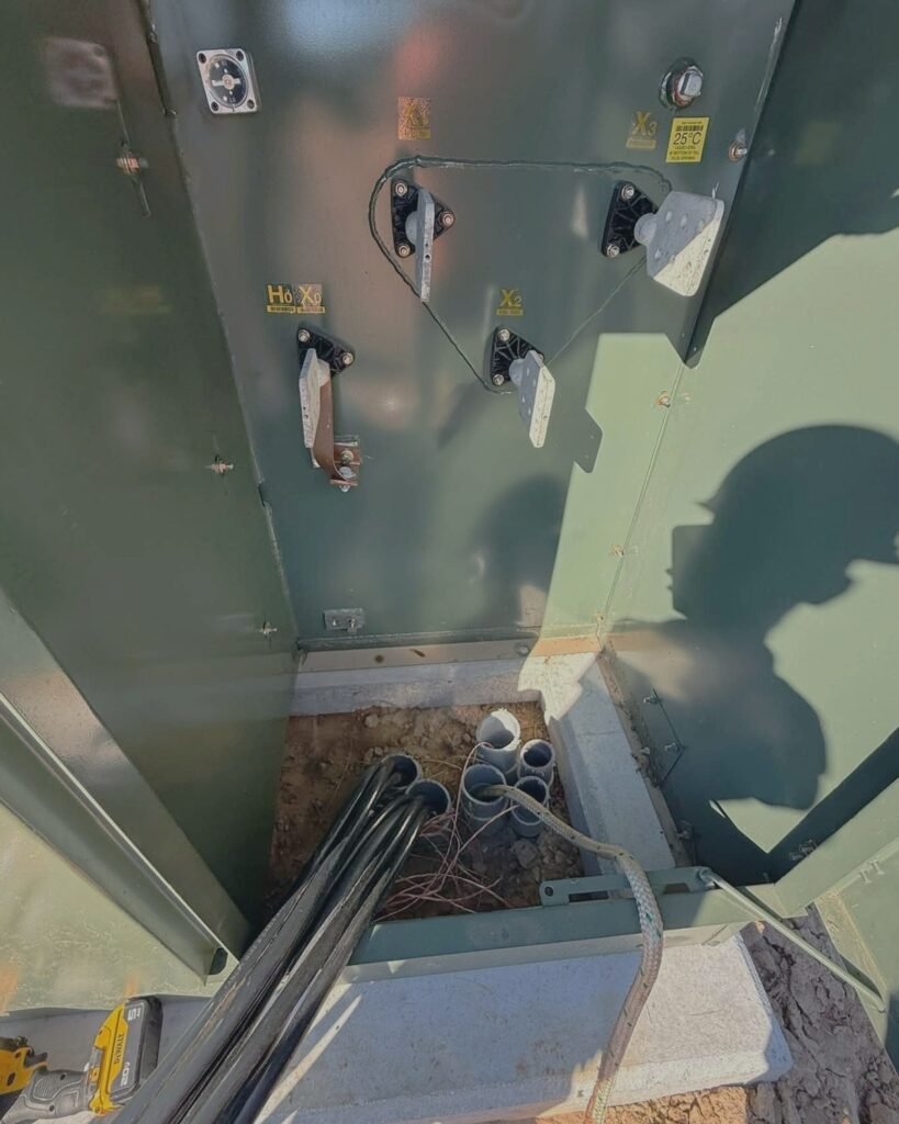 Transformer cabinet with an electrician at work in Plattsburgh, NY
