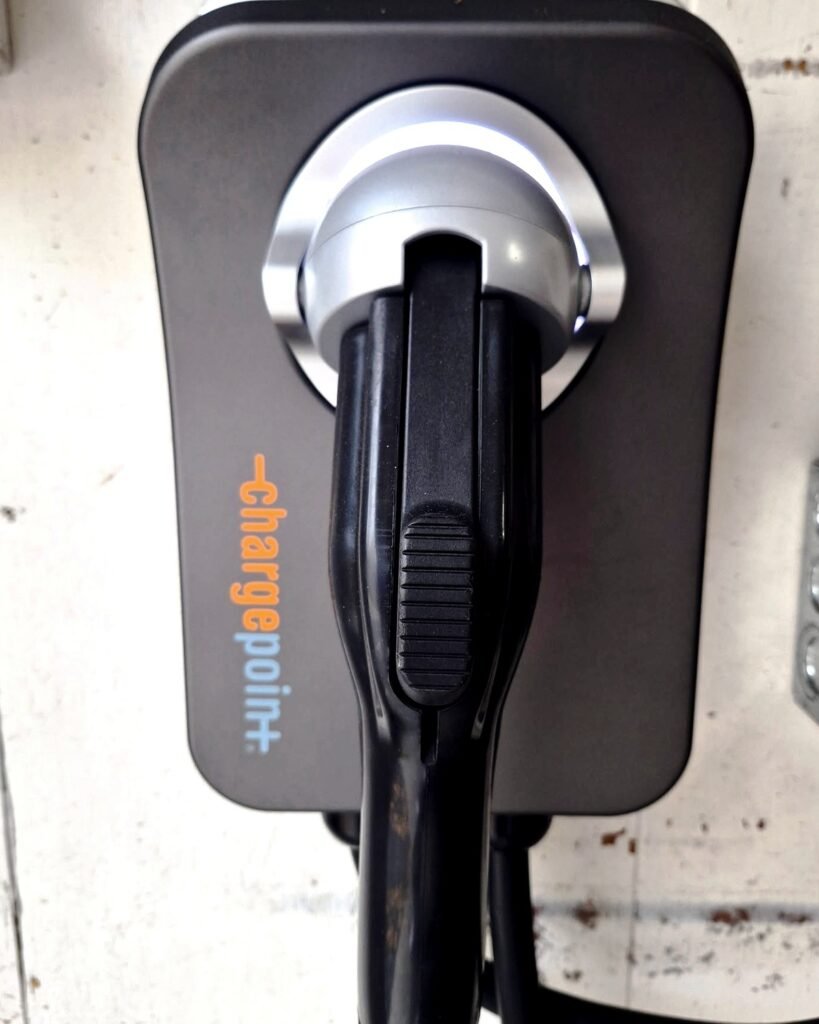 ChargePoint EV charger mounted on a garage wall in Plattsburgh, NY