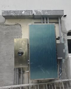 Kohler standby generator beside a meter and electrical panel in Plattsburgh, NY