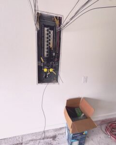 Electrical panel upgrade with exposed wiring in Plattsburgh, NY