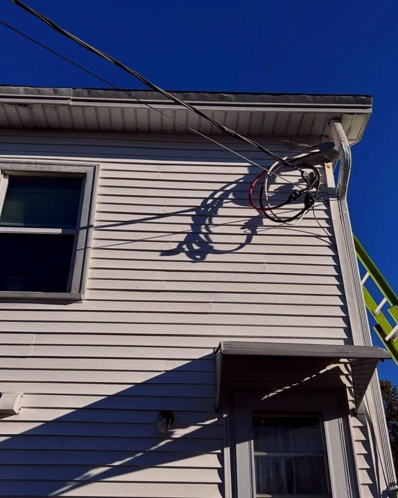 Service wire cleaned up at the side of a house in Plattsburgh, NY