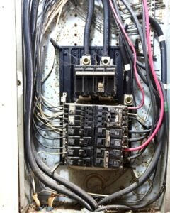 Crowded electrical panel with messy wiring ready for assessment in Plattsburgh, NY